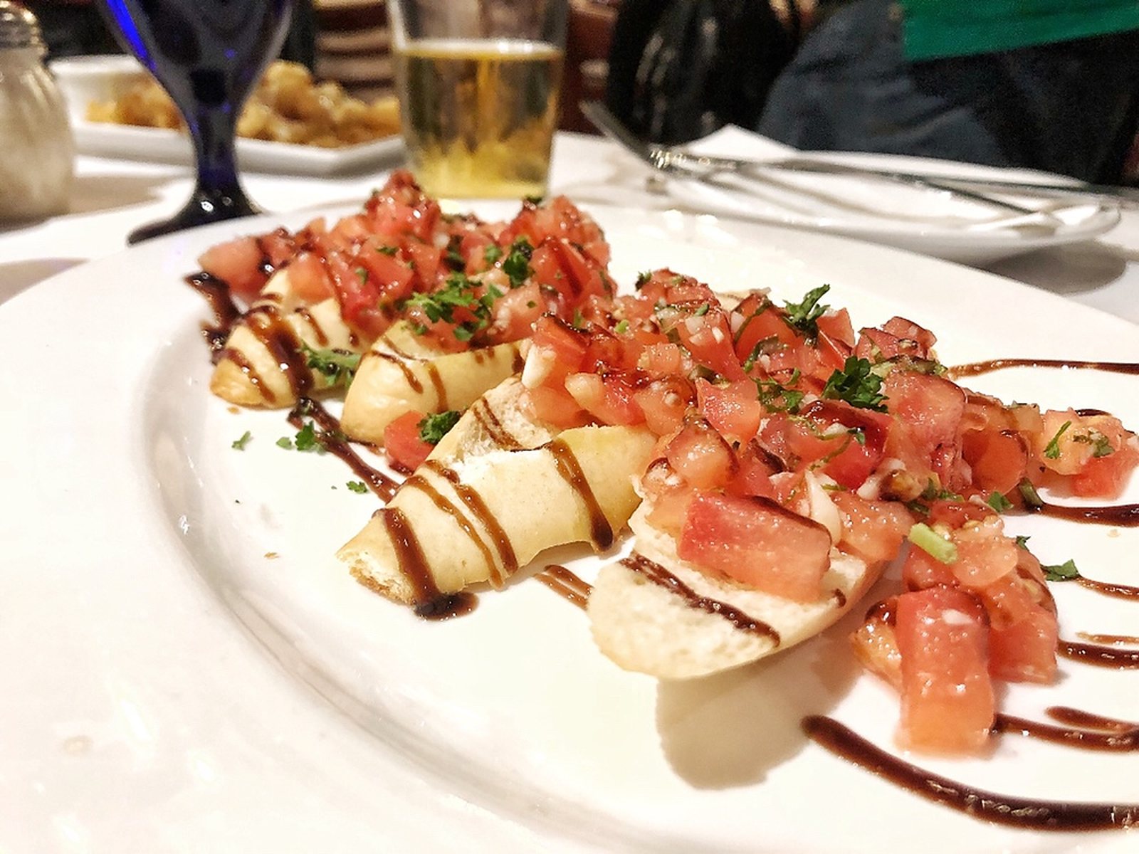 This crisp bruschetta is topped with zesty San Marzano tomatoes and basil sourced from Italy, and drizzled with balsamic.