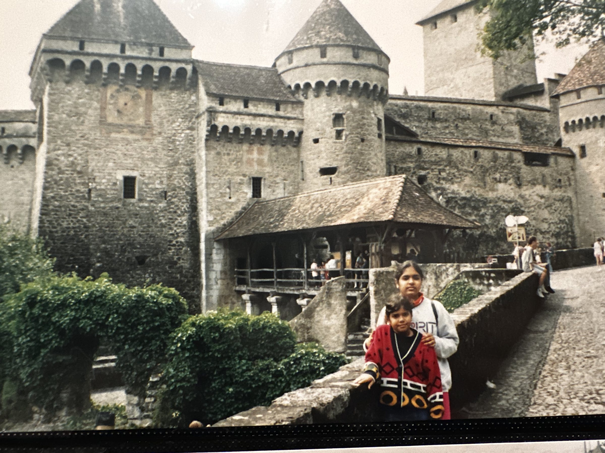 Standing in front of th Chateau de Chillon, Montreux during a childhood trip to Switzerland